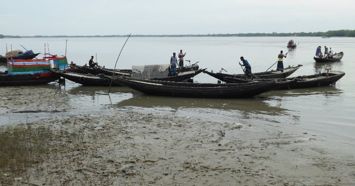 Bangladesh fisherman in boats on a river